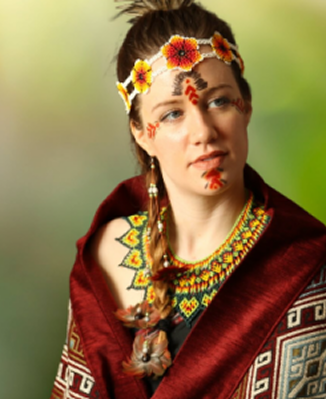 The image showcases a person wearing a variety of traditional textiles and adornments from various Indian cultures, often associated with tribal and northern regions.