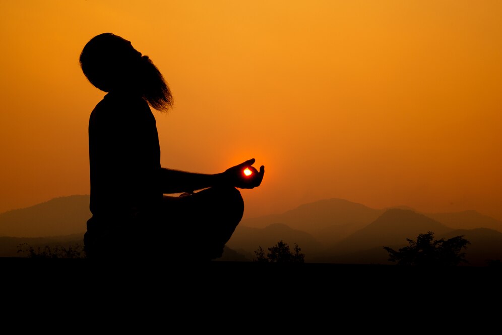 This image represents a moment of meditation or spiritual practice, often linked to traditional Indian disciplines like yoga.