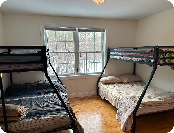 These are modern black metal twin over full bunk beds featuring industrial styling with sturdy linear tube frames.